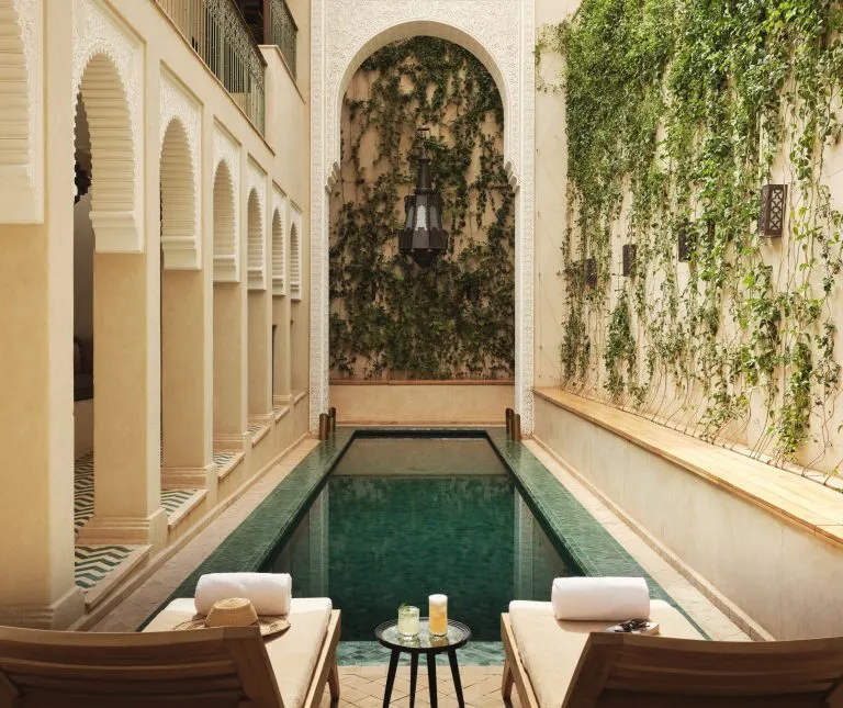 Arched courtyard and plunge pool at IZZA Marrakech