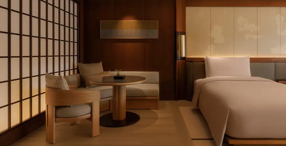 Capella Kyoto Review 2026: Inside Japan's Most Anticipated Luxury Opening 7 Capella Kyoto standard guest room interior with shoji screen and walnut furniture