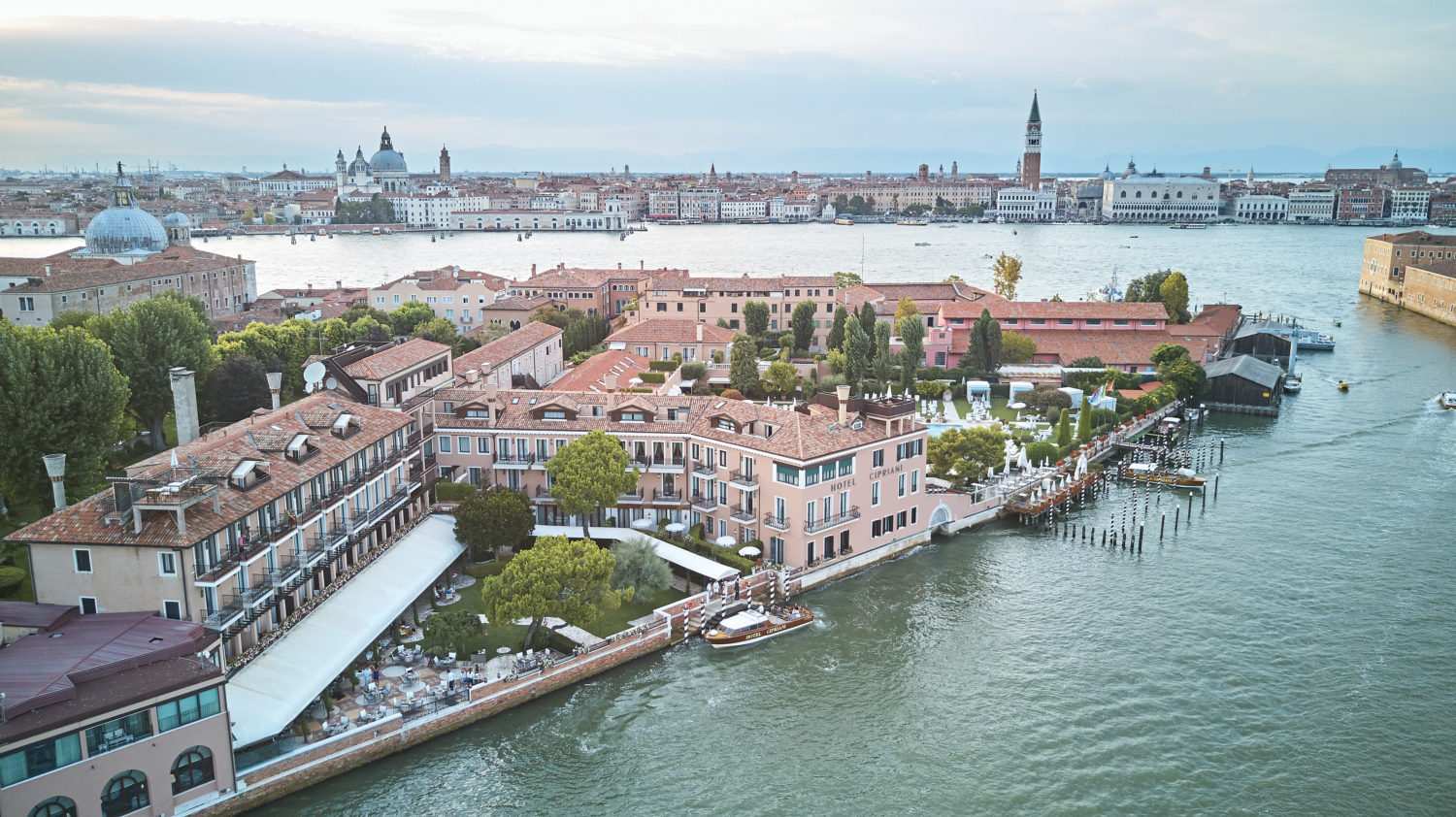 Hotel Cipriani on Giudecca Island in Venice with St Mark's Campanile and Doge's Palace visible across the lagoon, photographed from above 