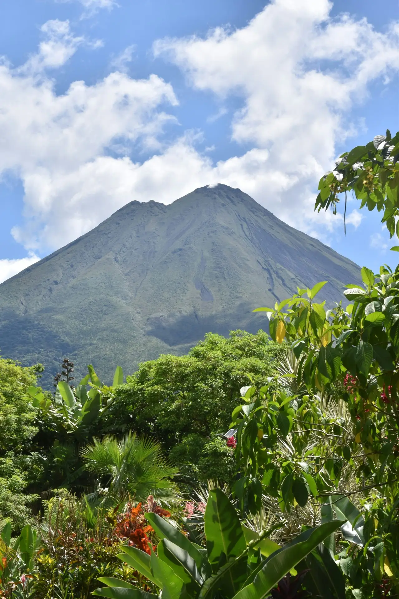 Solo travel destinations 2026: Arenal Volcano rises above the rainforest in Costa Rica, where the country ranks ninth on the list as the gentlest introduction to Latin America for first-time solo travelers