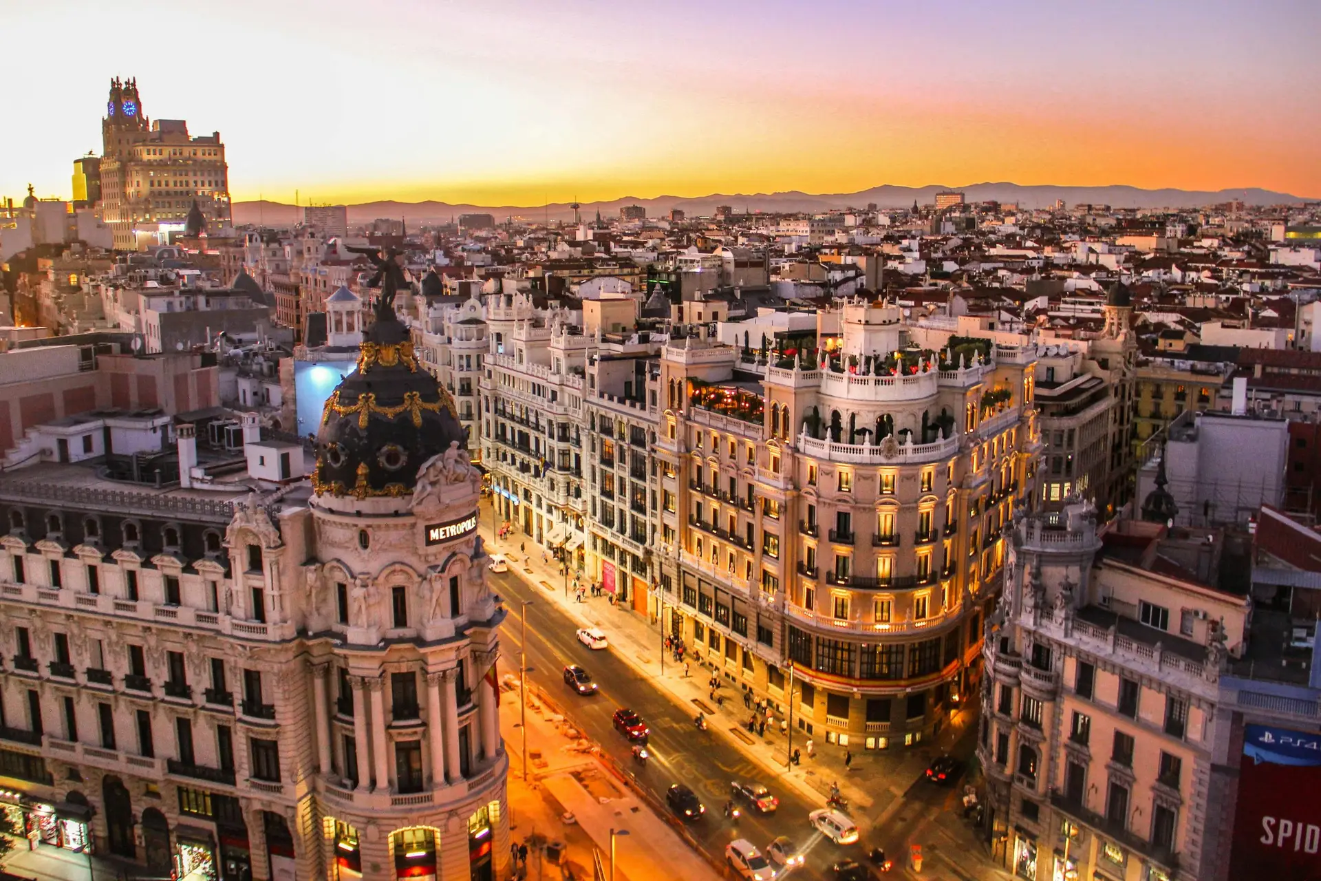Solo travel destinations 2026: Madrid's Gran Via at sunset with the Metropolis building, where Spain ranks eighth on the list as a top European destination for solo travelers seeking culture, food, and English access
