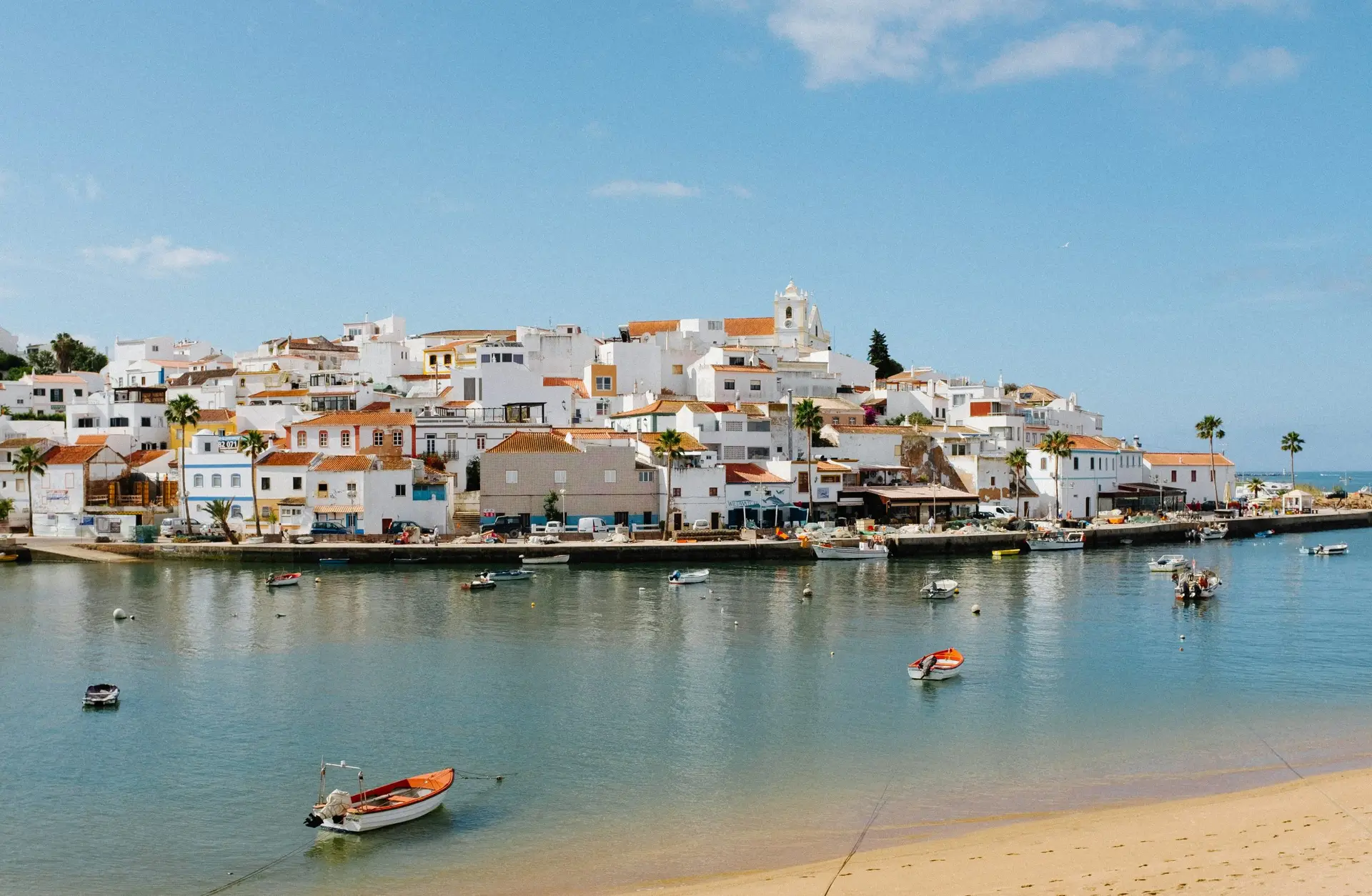 Solo travel destinations 2026: the fishing village of Ferragudo on Portugal's Algarve coast, where Portugal ranks third on the list as Western Europe's most affordable first-timer destination

