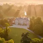 Farm-to-table luxury hotels 2026 - Heckfield Place aerial view at sunrise Hampshire