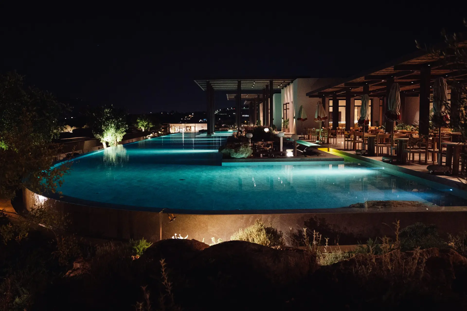 JW Marriott Crete Resort & Spa: The Complete Guide to Greece’s First JW Marriott 2 The lit reflecting pool beside the Fayi restaurant terrace at JW Marriott Crete at night