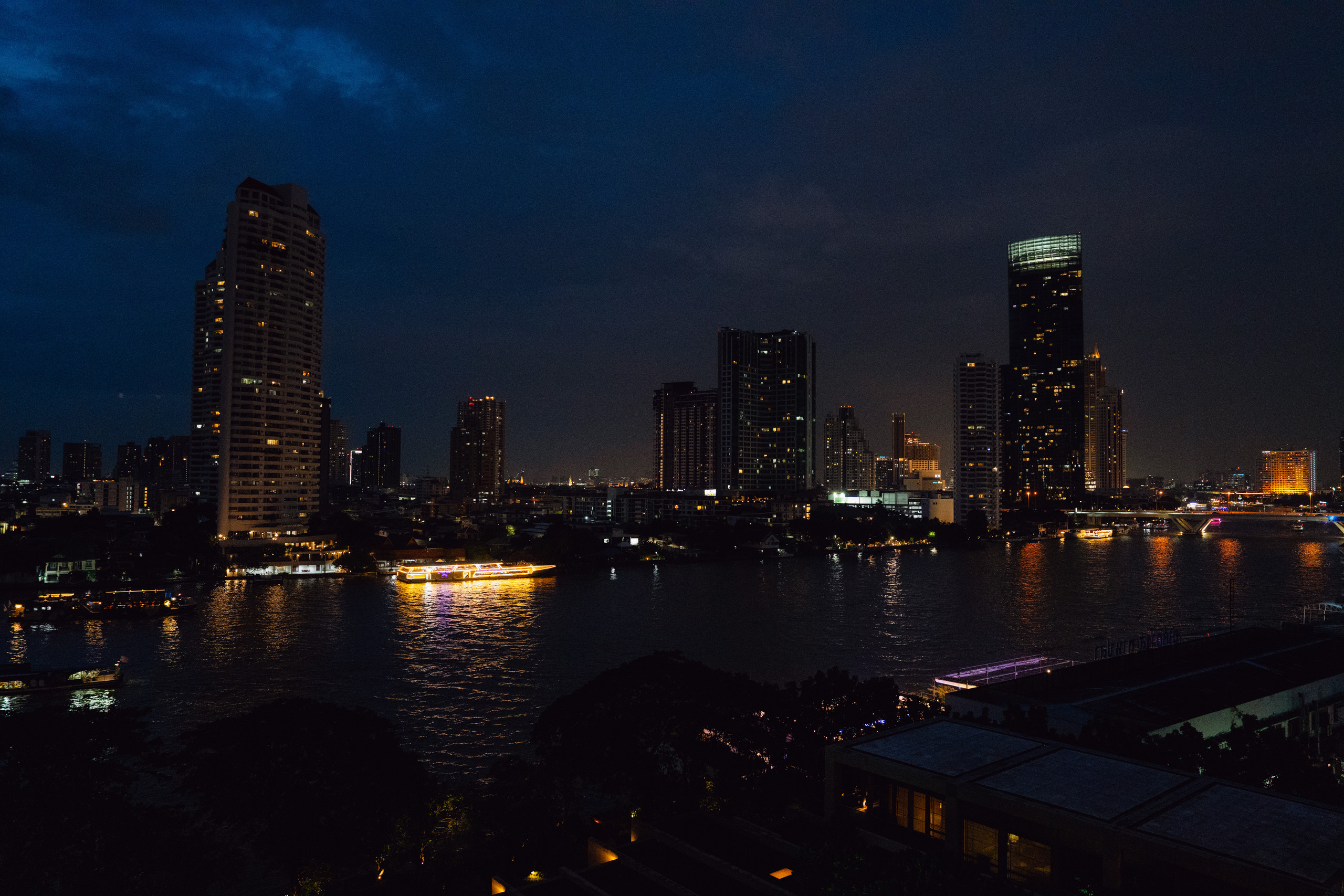 Bangkok skyline and the Chao Phraya River at night from Capella Bangkok