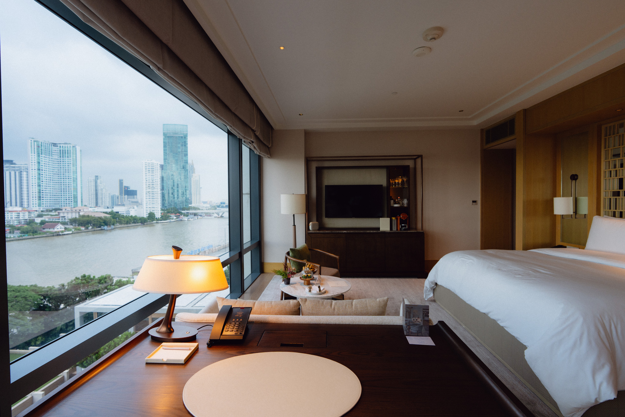 Desk by the window with river view in a Riverfront Premier room at Capella Bangkok