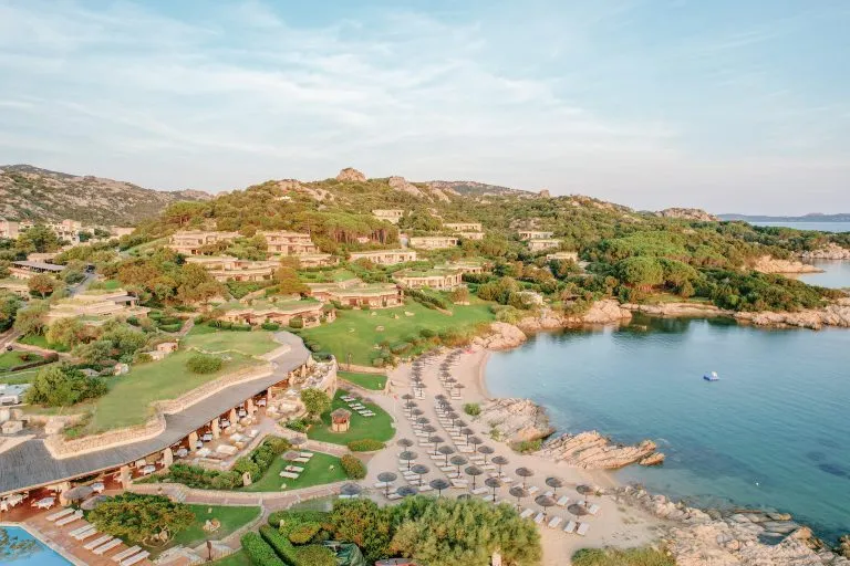 Aerial view of Hotel Pitrizza on the Costa Smeralda with its private beach and the bay