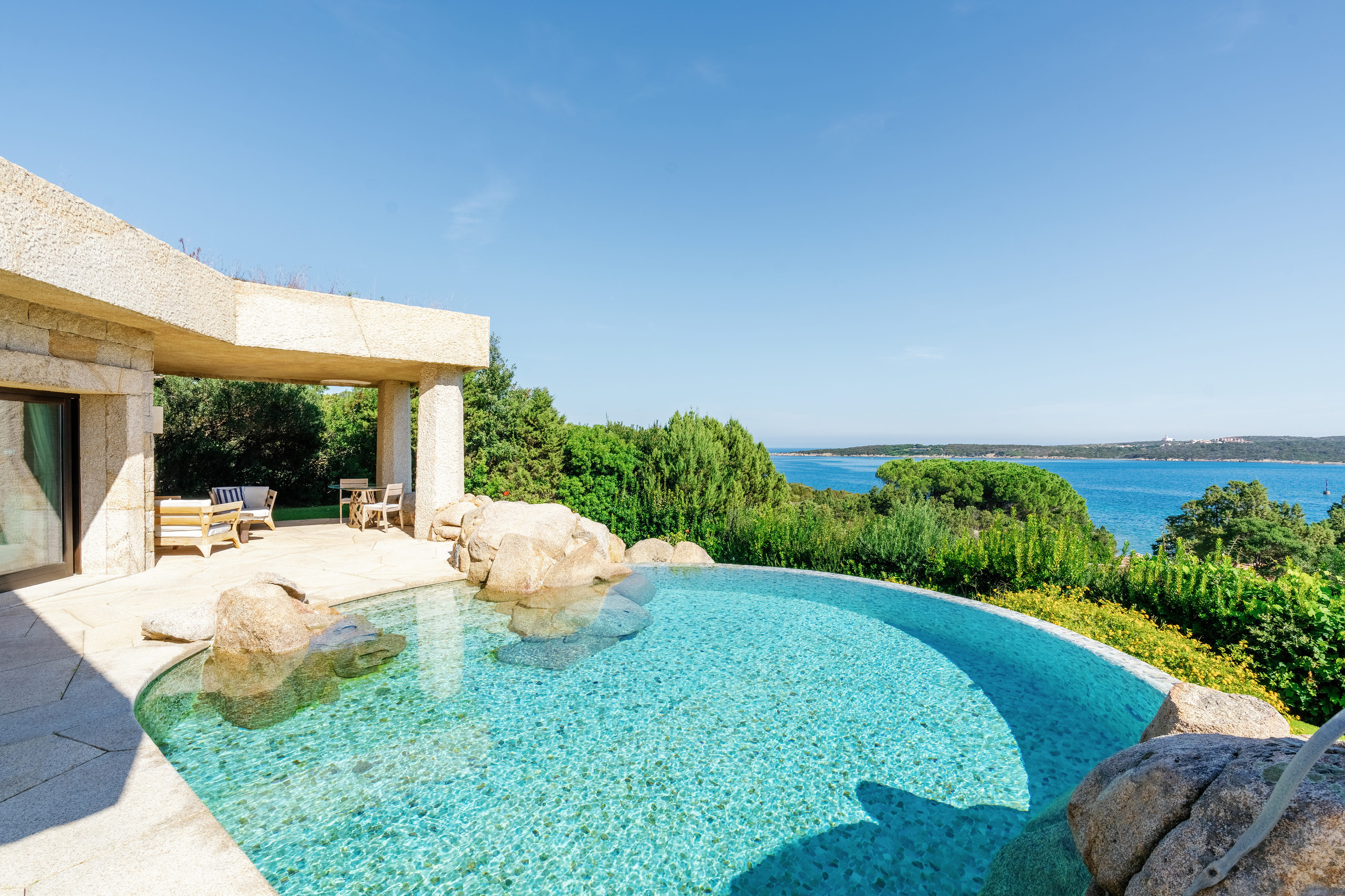 Private pool of a Pool Suite among granite boulders at Hotel Pitrizza