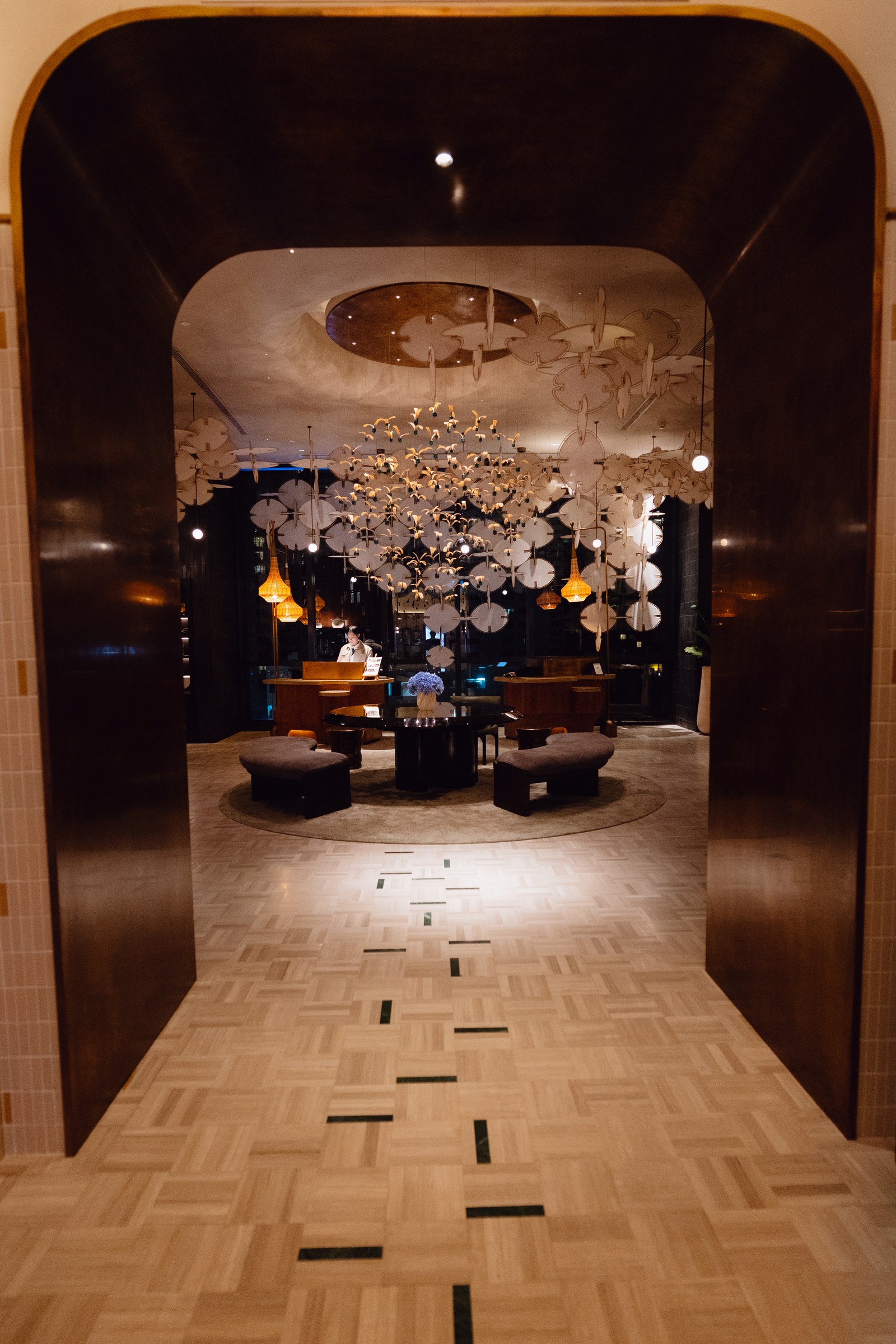 KROMO Bangkok 10th-floor lobby with ceiling art installation
