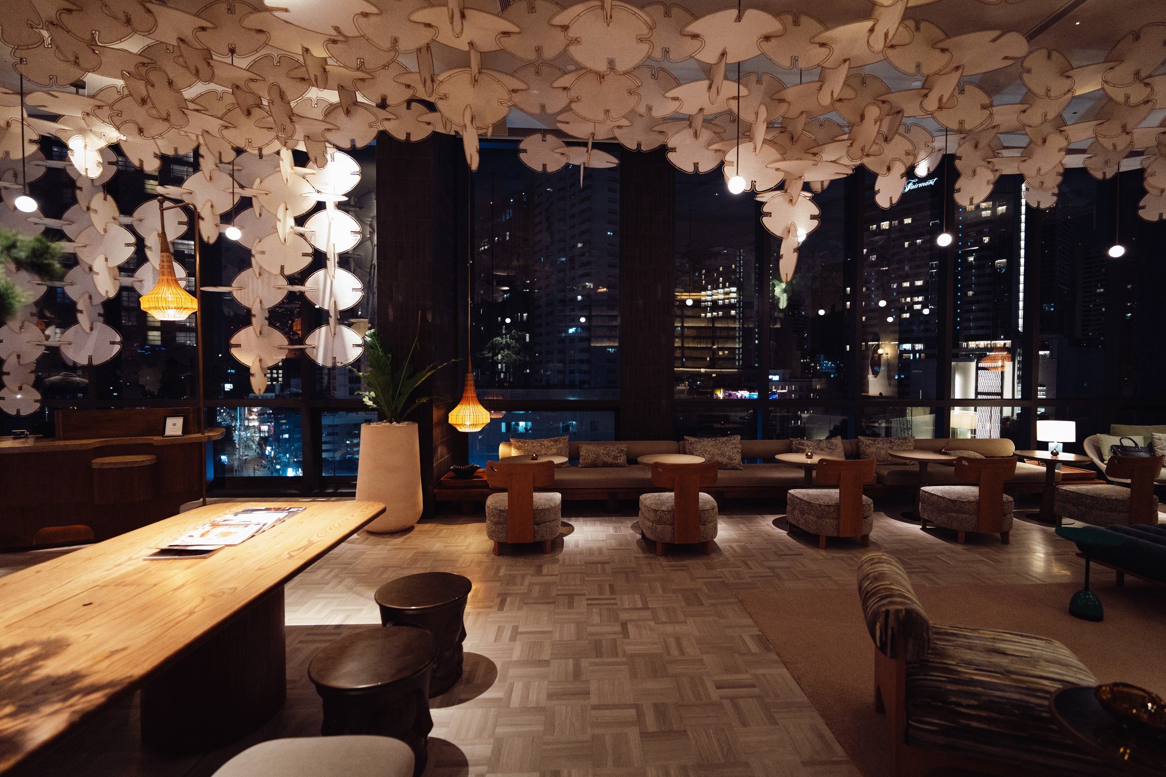 KROMO Bangkok lobby lounge with Bangkok city view at night